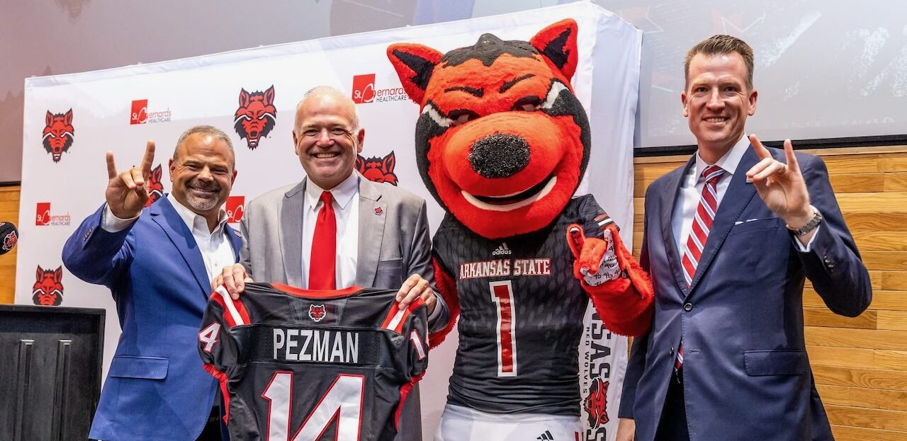 picture of Todd Shields, Chris Pezman, Howl mascot and Brendan Kelly