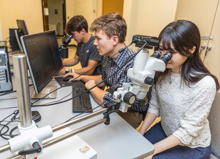 Picture of A-State engineering students working in a university laboratory.