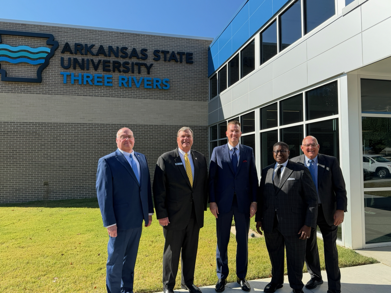 Picture of trustees at ribbon-cutting ceremony for new nursing building at ASU Three Rivers