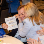 Picture of Jackson St. Pierre, a fourth-year medical student at NYIT College of Osteopathic Medicine at Arkansas State University, hugging his mother, Angel, after learning that he matched into the internal medicine residency program at St. Bernards Medical Center in Jonesboro.