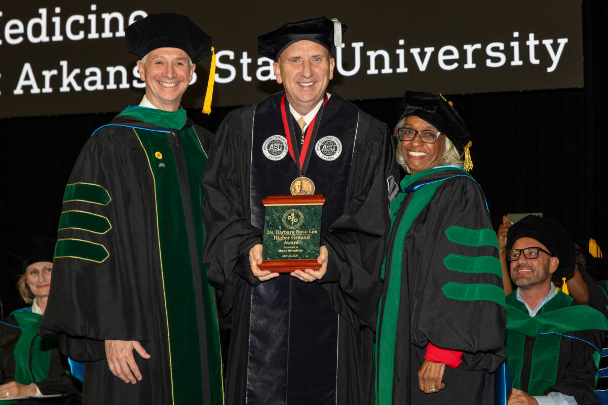 Picture wearing commencement regalia (from left) are Dr. Shane Speights, award recipient Shane Broadway and Dr. Barbara Ross-Lee.