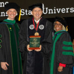 Picture wearing commencement regalia (from left) are Dr. Shane Speights, award recipient Shane Broadway and Dr. Barbara Ross-Lee.